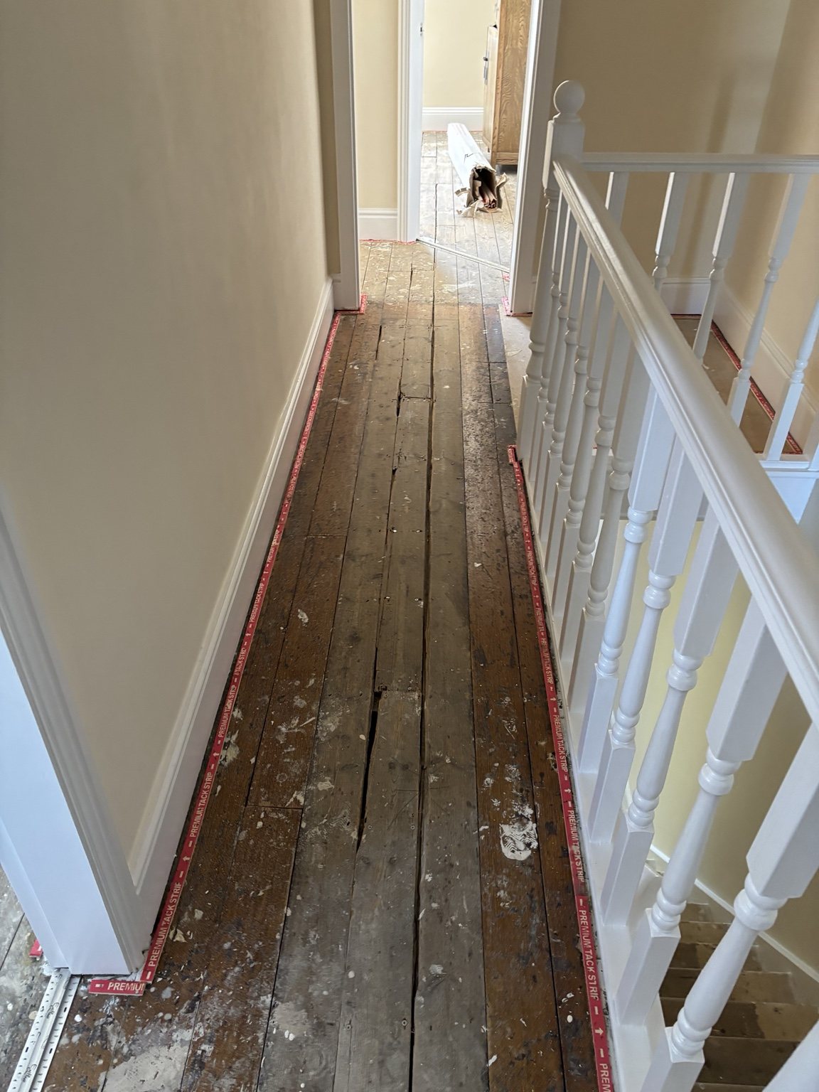 Hallway and stairs before carpet fitting in Doncaster property