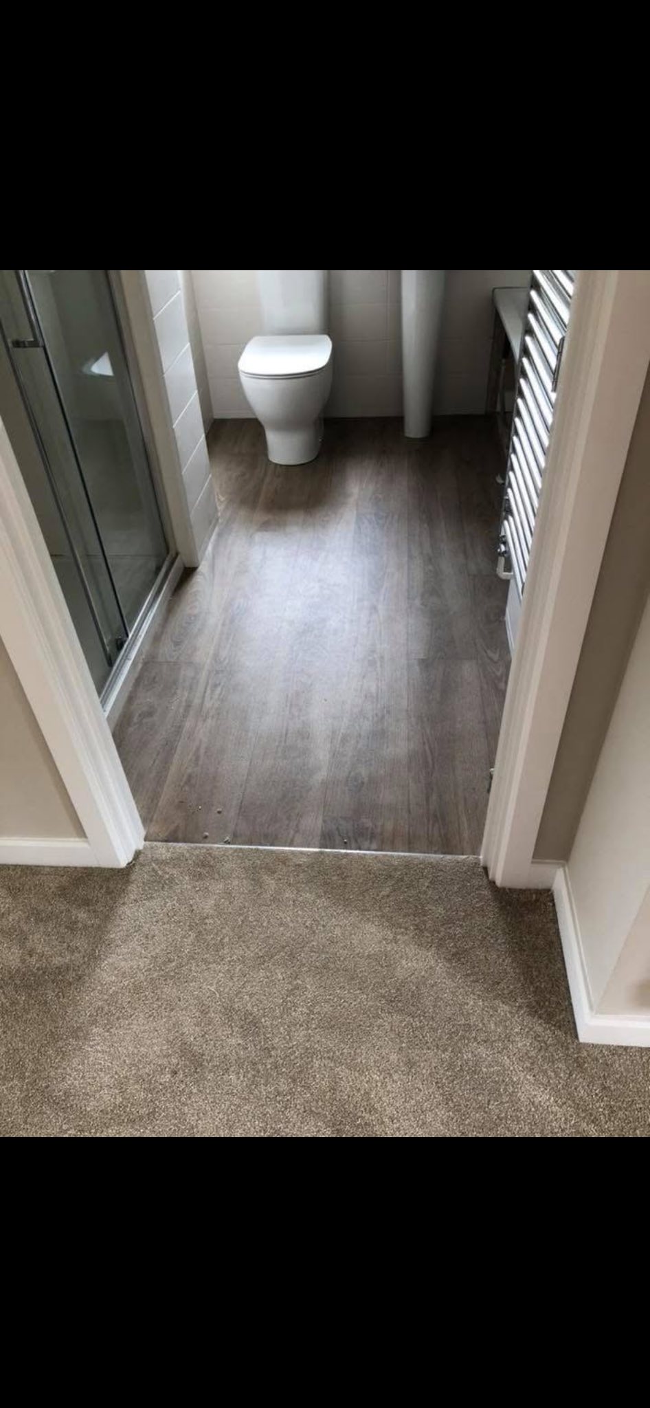 Wood-effect vinyl flooring in Doncaster bathroom